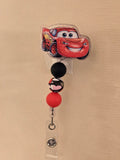 Race car badge reel