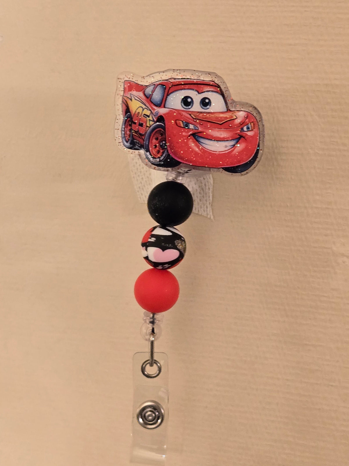 Race car badge reel